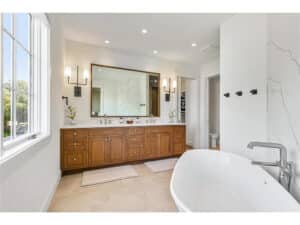 Streeter built primary bath, lakeviews, large windows, tiled floors, dual vanity at Lakeview Avenue Deephaven