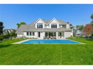 Backyard image of Streeter Built Home with green grass and pool at Lakeview Avenue Deephaven