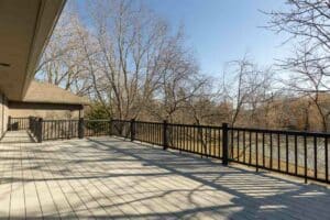 South facing deck overlooking backyard and tennis courts