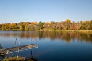 Calm Lake with Fall Colors and dock